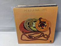 Front view of the stack of vinyl records featuring "The Best of Isaac Hayes" album cover.