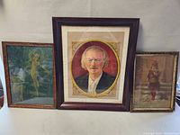 Photo showing all three framed prints including the portrait in the center and two smaller prints to sides