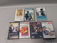 Photo of 7 jazz cassette tapes laid out, showing artists and titles clearly for identification