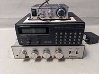 Three stacked electronic devices: Lepai amplifier on top, Realistic scanning receiver in the middle, Archer video color processor on the bottom.