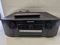 Front view of receiver with remote on top