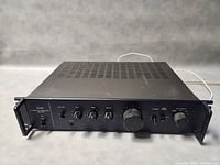 Front view of amplifier showing front panel controls and overall condition