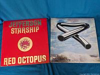 Front covers of Jefferson Starship Red Octopus and Mike Oldfield Tubular Bells vinyl records.