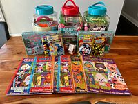 Photo of the lot with two large craft jars and several colorful children's activity books.