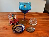 Lot overview showing all five items on wooden table.