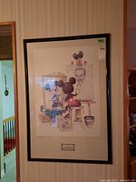 Framed print showing Mickey Mouse painting a portrait of Walt Disney viewed from an angle.