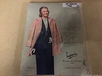 Front cover of the Simpsons 1952 Spring and Summer store catalog showing illustration of woman in 50s fashion with a pink coat and blue headscarf.