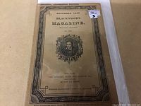 Front cover of Blackwood's Magazine December 1927 edition, showing detailed borders, title, date, and portrait illustration, with minor wear.