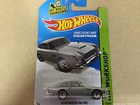 Photo of the Hot Wheels diecast Aston Martin 1963 DB5 car from James Bond Goldfinger sealed on original card.