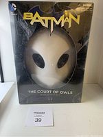 Full front view of the Batman The Court of Owls Book and Mask Set box, showing the owl mask through the clear plastic window. Box shows wear and creasing.