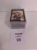 Stack of Advanced Dungeons & Dragons 2nd Edition trading cards with Fomorian card on top.