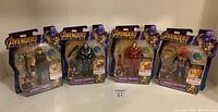 Front view of four Marvel Avengers Infinity War action figures in sealed blister card packaging showing Thor, War Machine, Iron Man, and Spider-Man.