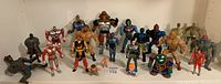 Front view of entire lot showing all figures including He-Man, Skeletor, Robocop and more