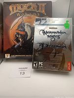 Front view of Myth II Worlds sealed box and Neverwinter Nights Platinum game in shrink wrap showing condition and packaging.
