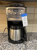 Front view of the Cuisinart Burr Grind and Brew coffee maker showing the digital display, control buttons, and stainless steel thermal carafe.