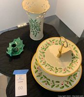 Photo showing all items in the lot: two-tier serving piece, matching vase, and small holly candle holder on a black mat.
