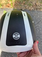 View of the helmet front showing the black and white color scheme, Rawlings logo, and '80 MPH' sticker