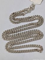 Photo showing the length and shine of the sterling silver chain.