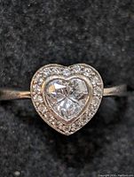 Close-up front view of the sterling silver ring highlighting the heart-shaped CZ center and surrounding smaller CZ stones.