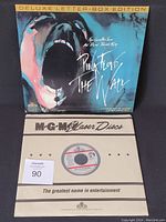 Front cover of the deluxe letter-box edition laser disc sleeve showing screaming figure artwork and title.