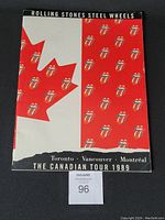 Front cover of the oversized tour book featuring a stylized Canadian flag with Rolling Stones tongue logos, text indicating 'Toronto, Vancouver, Montréal The Canadian Tour 1989'.