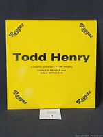 Front view of the yellow vinyl record sleeve with 'Todd Henry' and reggae branding.
