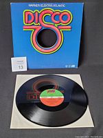 Boney M vinyl record with sleeve featuring Disco 7 colorful logo.