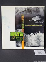 Front cover of A-Ha vinyl record single sleeve with band photo and artwork.