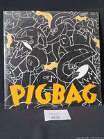 Front cover of the vinyl record single featuring abstract artwork and the Pigbag logo
