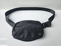Front view of the black Lululemon waist fanny pack showing the main compartment and strap
