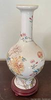 Front view of Lenox ceramic vase with floral Asian-inspired design on bulbous body and narrow neck