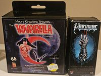 Original boxes for Witchblade Glove and Vampirella Ornaments showing branding and pricing.