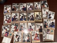 Photo showing 27 Leaf collector baseball cards from 1992 laid out on a table. Cards feature different players with portraits and action photos, some with gold border accents.