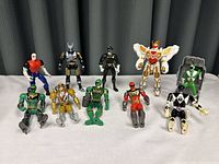 Group photo showing all 10 Power Rangers action figures in various poses and colors.