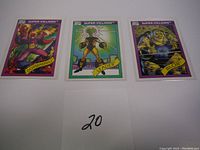 Three Marvel Universe Super-Villains cards: Dormammu, Leader, and Blob displayed side by side, showing front artwork and condition.