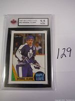 Front view of Wendel Clark 1987-88 O-Pee-Chee hockey card graded 9.5 NGM in protective case.
