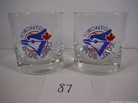 Two vintage whiskey glasses with Toronto Blue Jays logo facing forward.