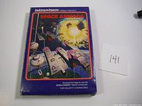 Outer box featuring colorful space battle artwork for Intellivision Space Armada game.