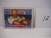 Front of the Allison Waterland Garbage Pail Kids trading card showing character in bathtub with rubber duck.