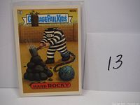 Garbage Pail Kids card titled Hard Rocky with cartoon character and ball and chain illustration.