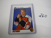 Front view of 1991 Upper Deck Peter Forsberg rookie hockey card featuring him in Flyers jersey, in protective plastic sleeve.
