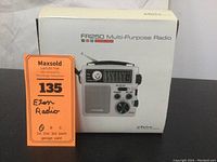 Front of the box showing Eton FR250 Multi-Purpose Radio image and branding with auction tag.