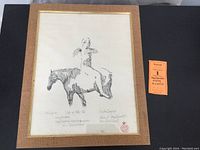 Full view of the framed etching with a label showing the lot number.