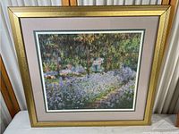 Full view of framed garden print showing gold frame with double matting and glass