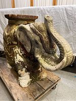 Full view of the elephant-shaped plaster composite plant stand with detailed design and coloration, showing overall form and size.