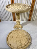 Full view of the stand with the removable ornate carved top showing the horse and carriage scene.