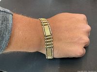 Bracelet worn on wrist, showing overall link style and fit
