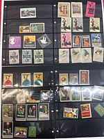 Overview of multiple pages with antique German poster stamps showing a range of industries including tourism, fashion, early electronics, and food product advertisements.