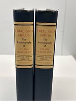 Spine view of both volumes showing title, author, volume numbers, publisher, and limited edition notation