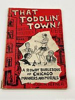 Front cover view showing red softcover with cartoon illustrations and title text 'That Toddlin' Town! A Rowdy Burlesque of Chicago Manners and Morals'